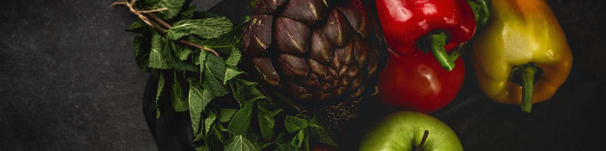 Mix of fresh vegetables on black background