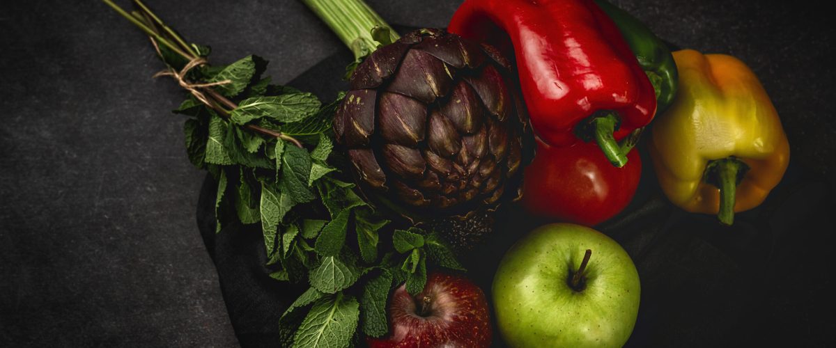Mix of fresh vegetables on black background